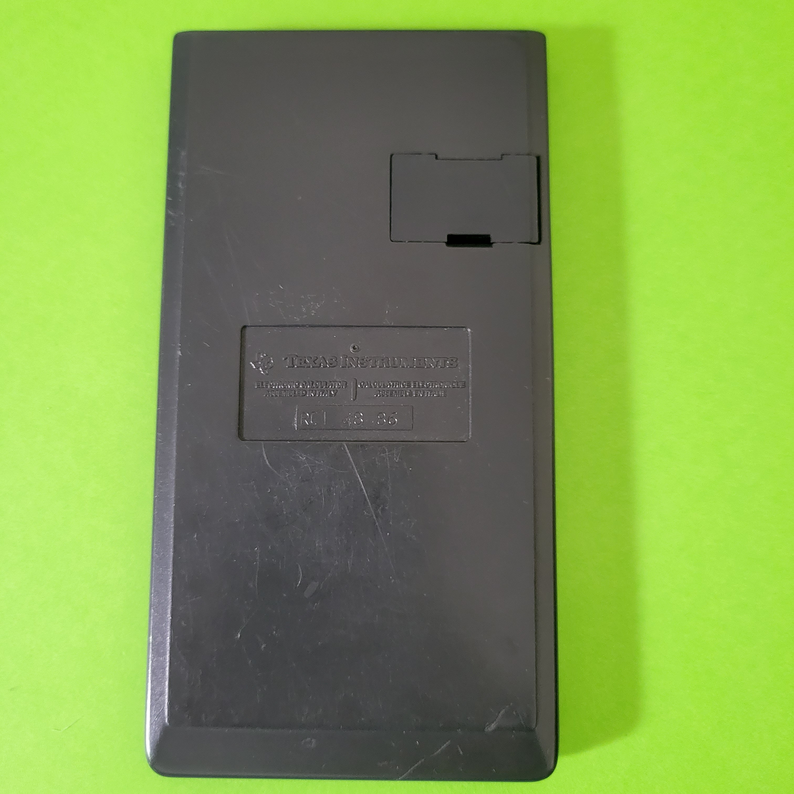 An image of the back of a texas instruments ti30 stat scientific/engineering calculator